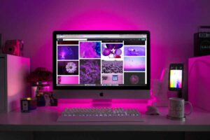 Web designing for beginners 2025 – modern workspace setup with purple lighting 